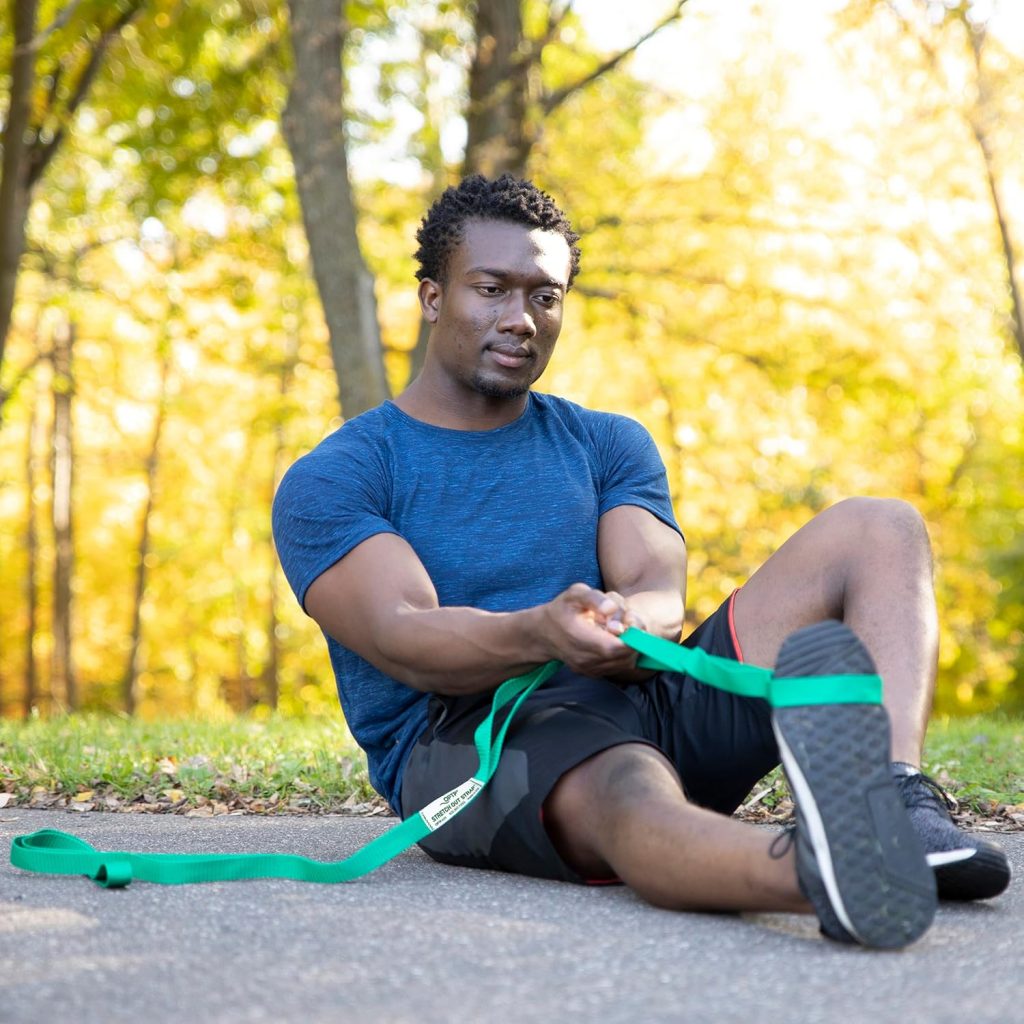The OPTP The Original Stretch Out Strap with Exercise Book is a durable, guided stretching tool designed to improve flexibility and muscle recovery. It includes an instructional book to help users stretch safely and effectively at home.